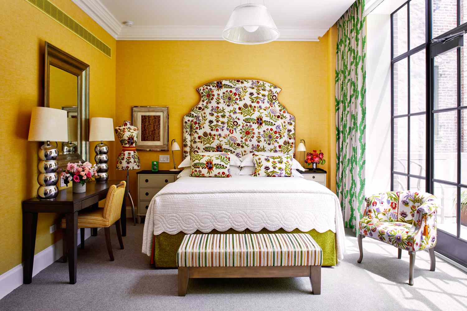 Colorful guest room inside Crosby Street Hotel