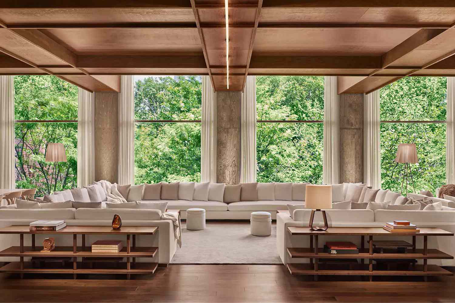 Lounge with huge couch and view of trees